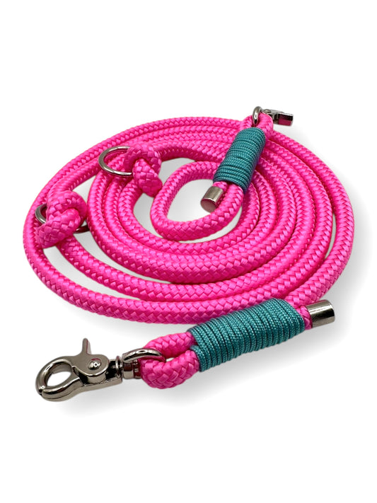Tauleine für Hunde in Neon rosa pink und blauen türkisen Details. Personalisierbar im Länge, Breite, Gewicht und Namen.